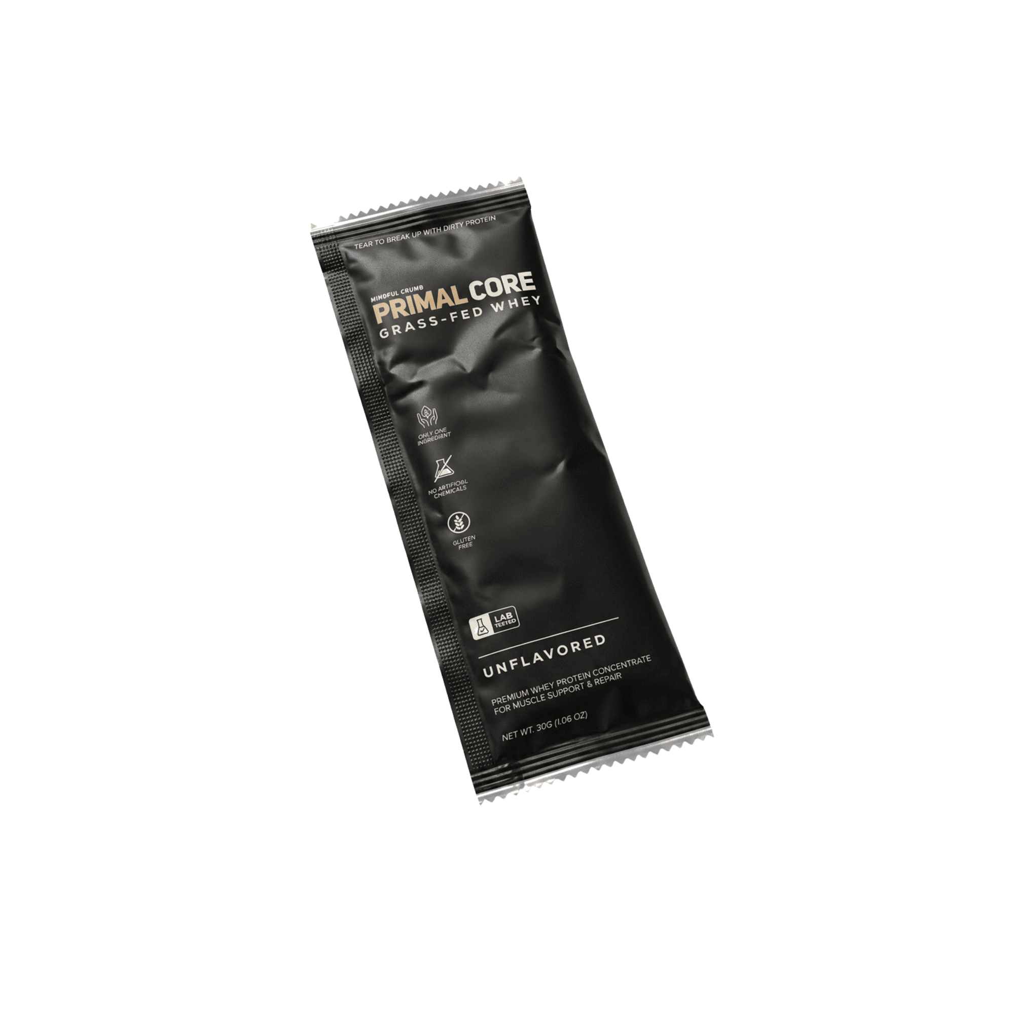 Primal Core single-serve sachet, matte black soft-touch foil with two-tone cream and gold-bronze PRIMAL CORE wordmark, three ingredient icons, LAB TESTED badge, UNFLAVORED — floating on the cream gallery wall